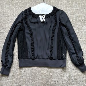 Rebecca Minkoff black blouse w v-neck key hole detailing. Ruffles w black lace